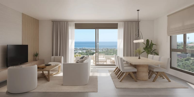 A new-build apartment building on the Costa del Sol seen from the side, its terraces looking out over the beach
