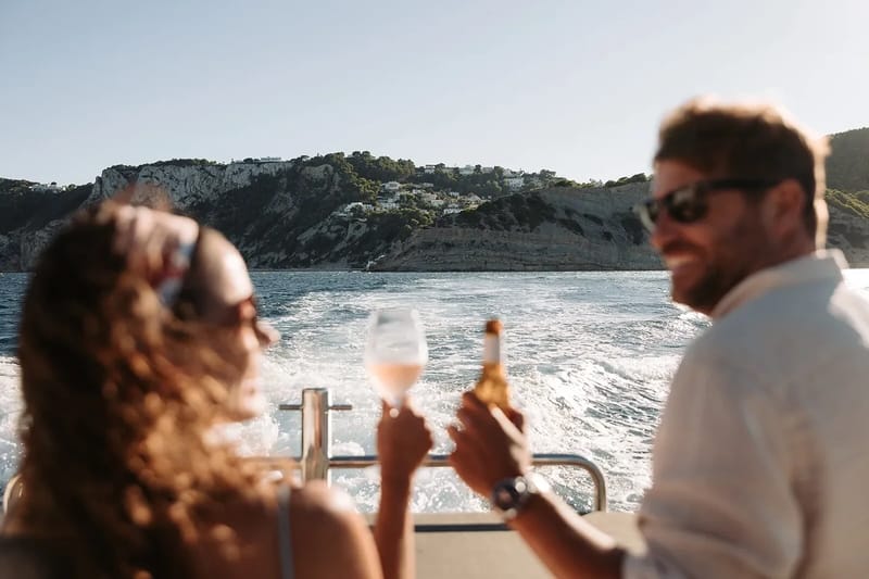 A couple talking together at a table by the sea