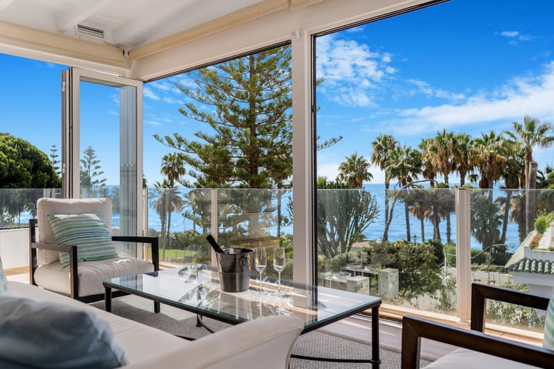 Beautiful frontline beach, four-bedroom end townhouse in the prestigious community of Marbellamar, on Marbella Golden Mile